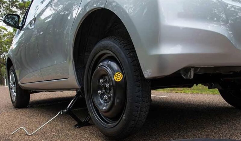 Spare tire replacement, close up photo